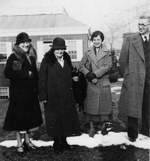 From inside back cover of DeVoe photo album. Gladys (Troup) Stickler made the following identifications starting at left (interview 1 July 2003): Capitola Troup (?), Lillian Adams (?), Rachel Troup, Charles Troup (?). Gladys thought the man at right looked like her father, although she didn't remember him wearing glasses.