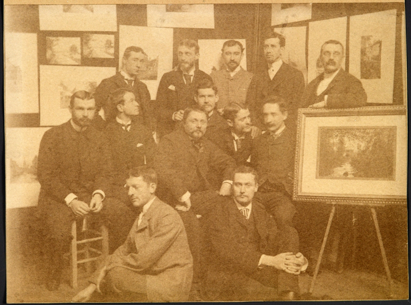 Photo once in possession of Edgar A. Josselyn, taken by John P. Benson. The subjects can be identified as follows, from writing by Edgar Josselyn on the reverse of a different photo, and from a letter Benson wrote in February 1889. Identifications are in order from left to right. Sitting on floor: John P. Benson, M. Saglio. Seated in second row: Ernest Flagg, Joseph McGuire, Austin W. Lord, Professor Leteurtre, Louis de Sibourg, Edgar A. Josselyn. Standing at rear: Albert L. Brockway, George Cary, Juan Guillermo de Lavalle, Edward L. Tilton, William A. Boring.