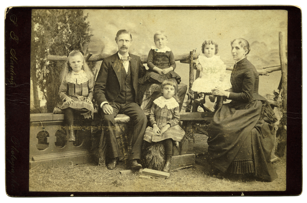Print, 14.1 cm x 10.1 cm, mounted on card, 16.4 cm x 10.6 cm. At left edge: "S. F. Harding Photographer". Photo provided by Margaret Troupe, May 2003, borrowed from the estate of Toby Harrison, a descendant of John Bruce Troup.
Move the cursor over the image to see the name of each individual. Click on a person to open the page for that person.
Marion DeVoe gave another copy of this print to Nancy (DeVoe) Webert, and identified the persons in it.